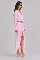 Pink ruffle mesh crop top and high low maxi skirt side view